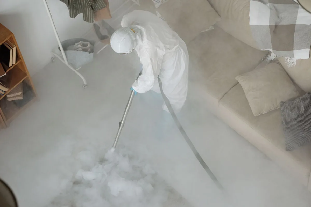 Biohazard cleanup technician in protective equipment, Compo, CT